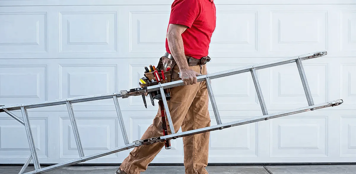 Garage door repair technician arriving with tools and ladder in Chula Vista, CA
