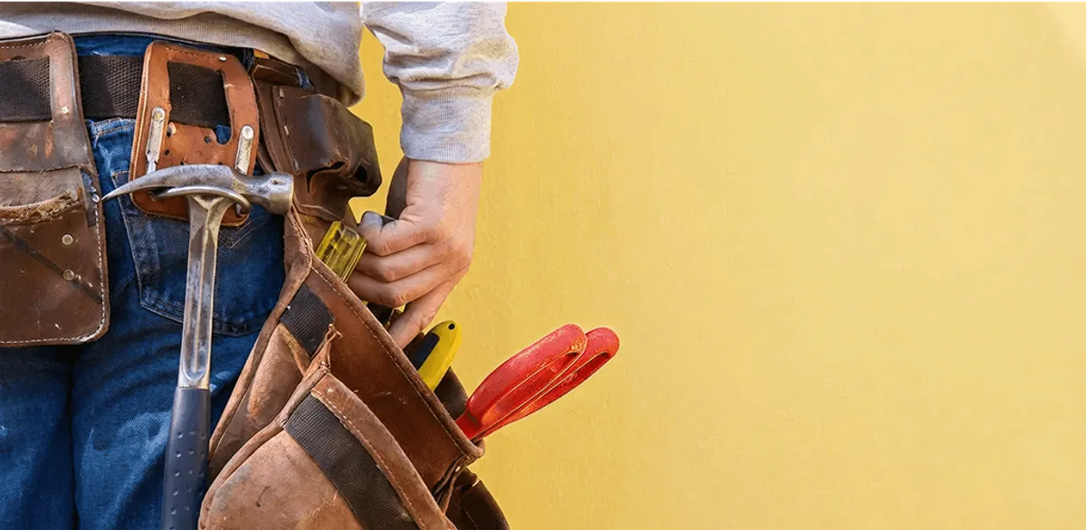 Handyman with tool belt ready for home repairs and maintenance in Chula Vista, CA